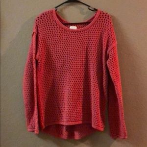 Salmon sweater with small holes
